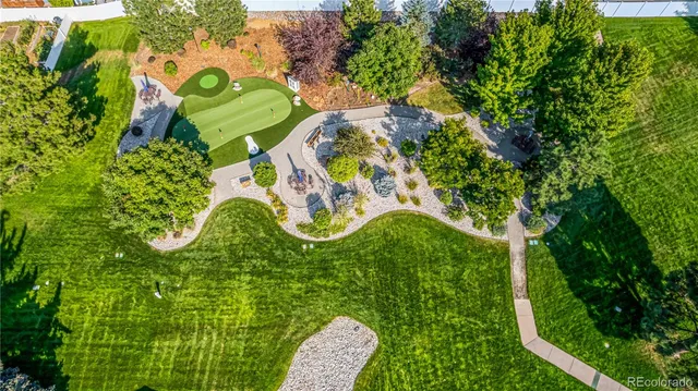an aerial view of multiple houses with yard