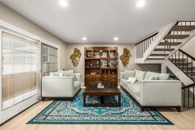 a living room with furniture and a rug