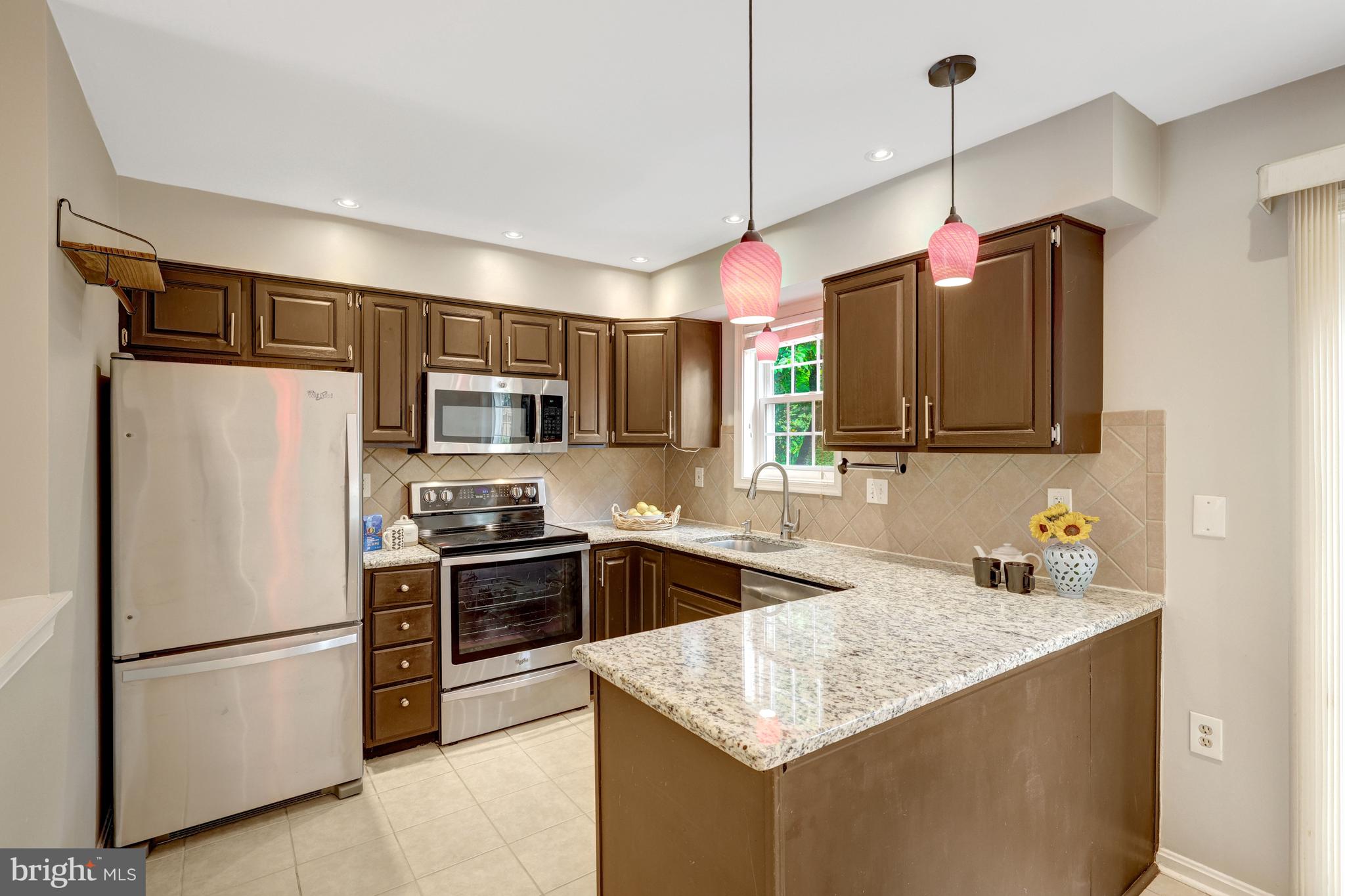11992 Sentinel Point Court Reston, VA 20191 - Photo 18 of 49 Granite counters and stainless steel appliances