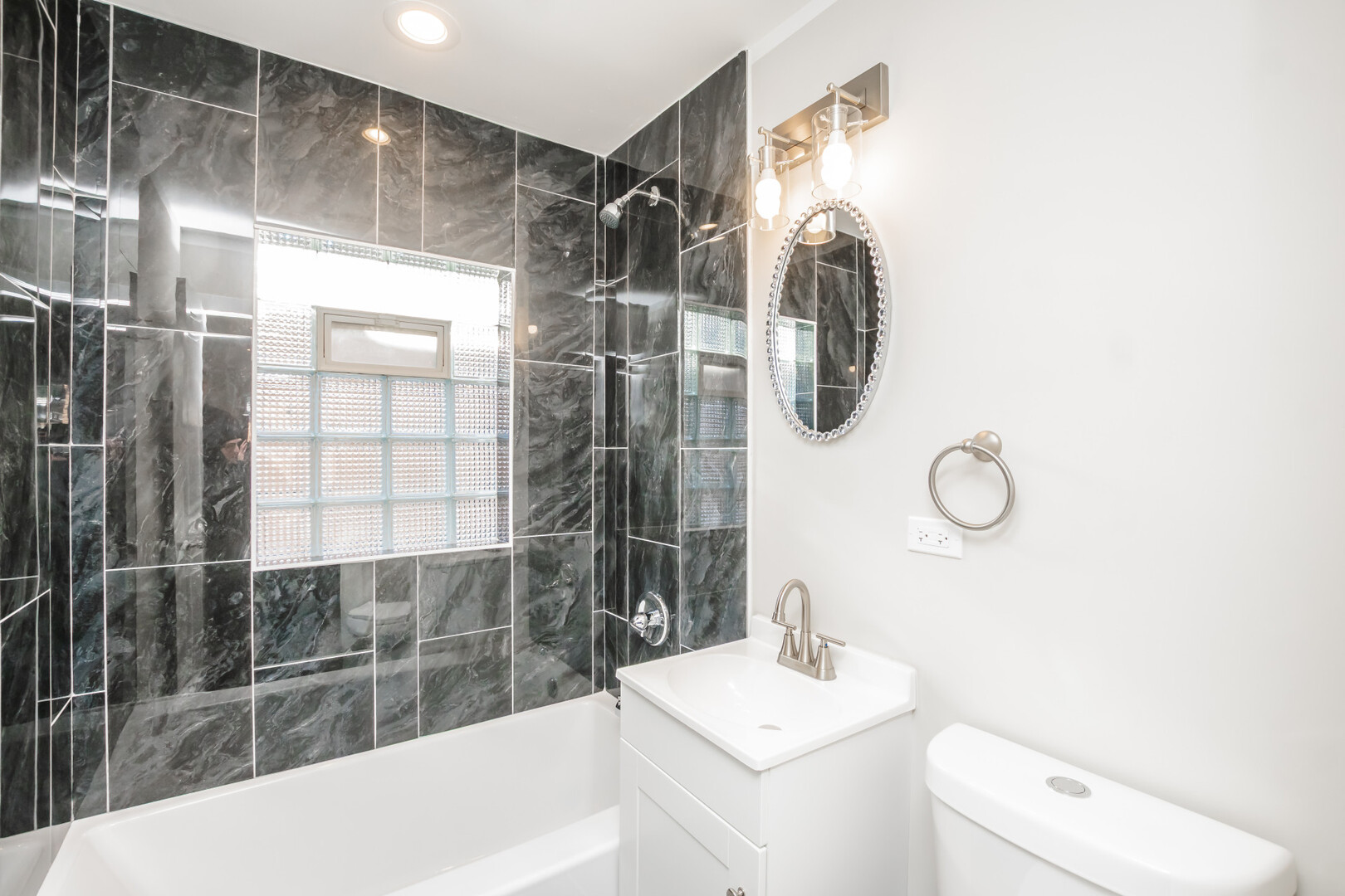 9800 South Drexel Avenue Chicago, IL 60628 - Photo 11 of 16 a bathroom with a sink toilet and shower