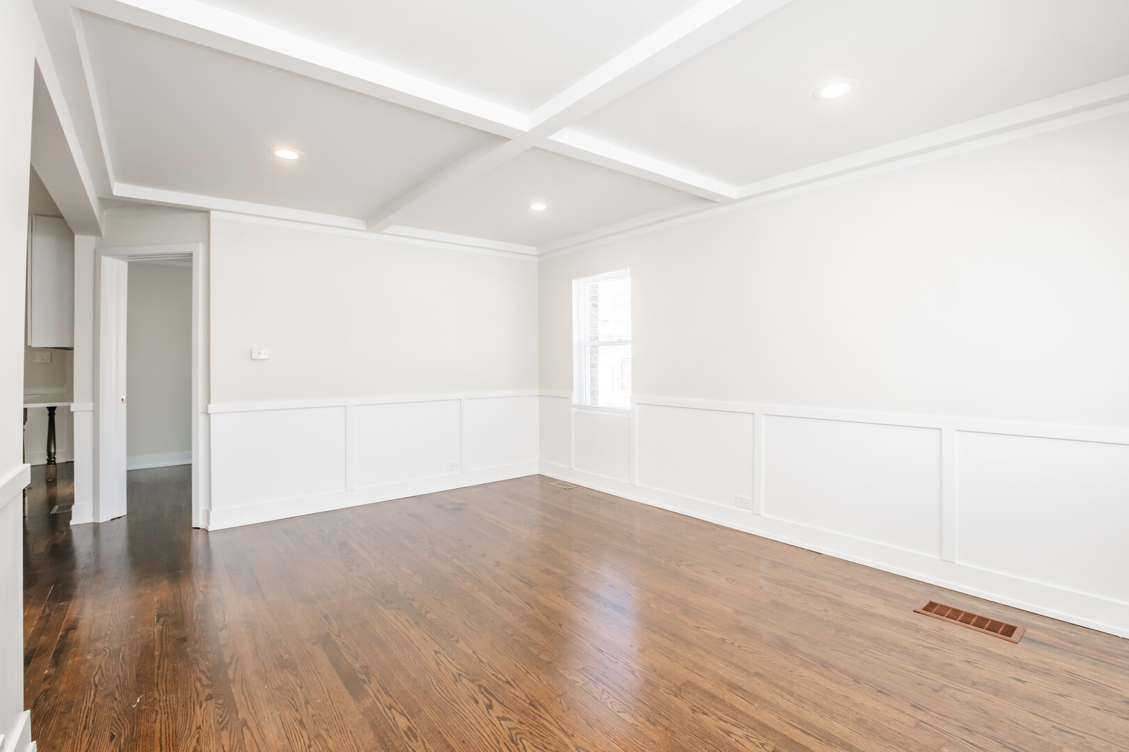 9800 South Drexel Avenue Chicago, IL 60628 - Photo 3 of 16 an empty room with wooden floor