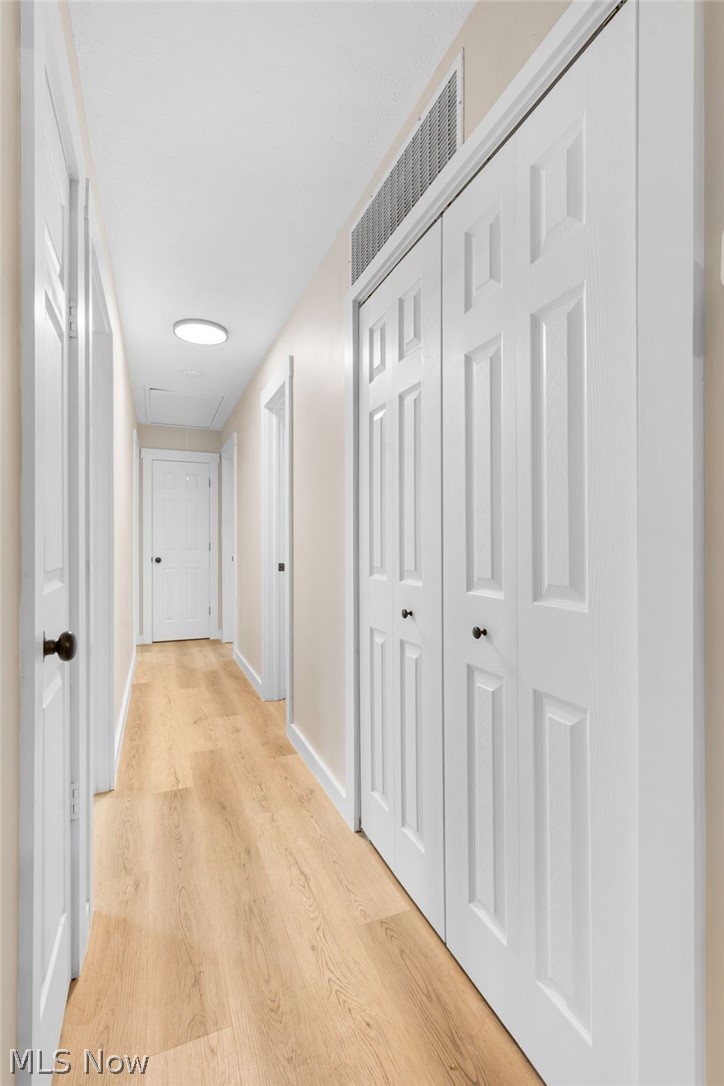 8304 Cedar Road Chesterland, OH 44026 - Photo 15 of 31 Hall with light wood-style floors and baseboards