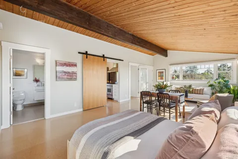 a backyard of a house with table and chairs