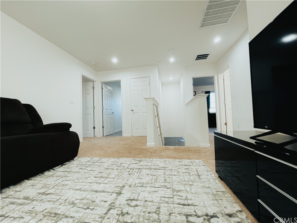 385 Ostrander Avenue Merced, CA 95341 - Photo 11 of 12 a living room with a couch and a flat screen tv