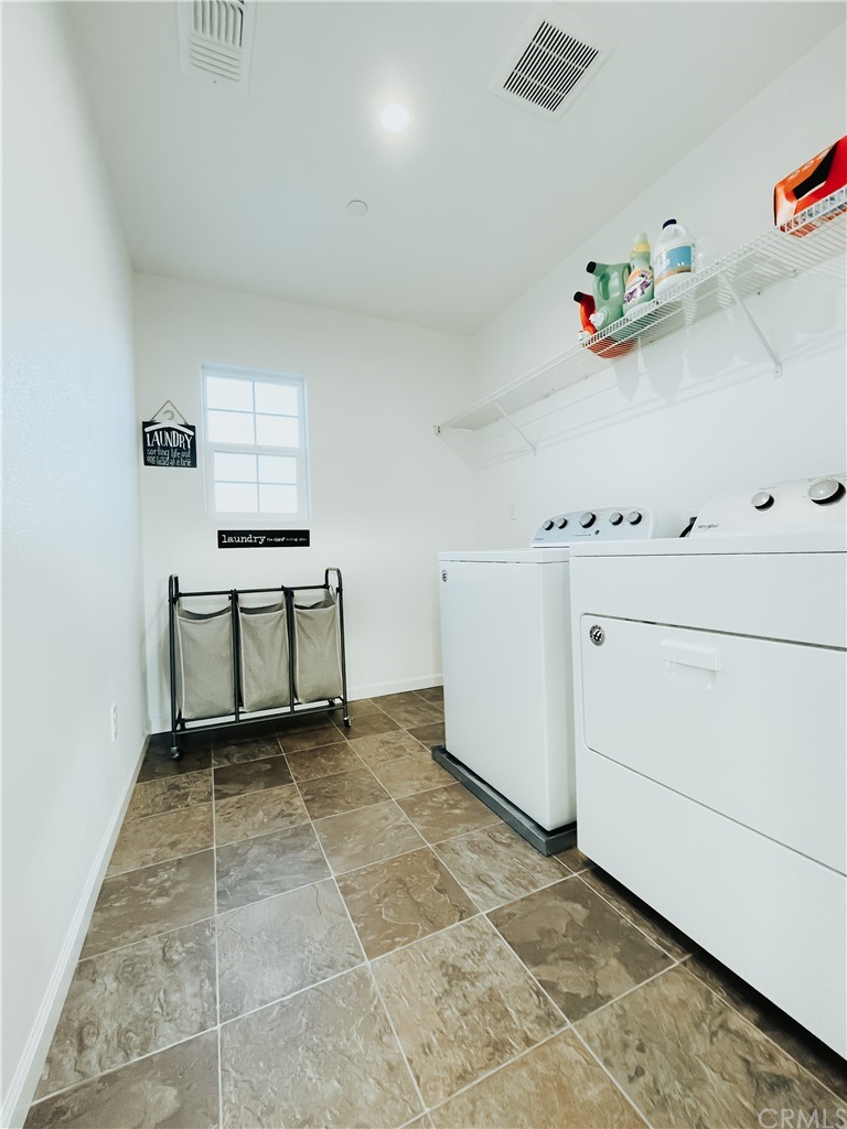 385 Ostrander Avenue Merced, CA 95341 - Photo 5 of 12 a view of kitchen with cabinet and baby crib