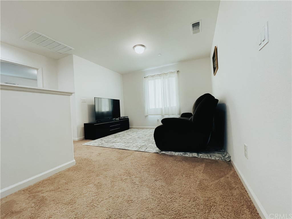 385 Ostrander Avenue Merced, CA 95341 - Photo 7 of 12 a living room with furniture and a flat screen tv