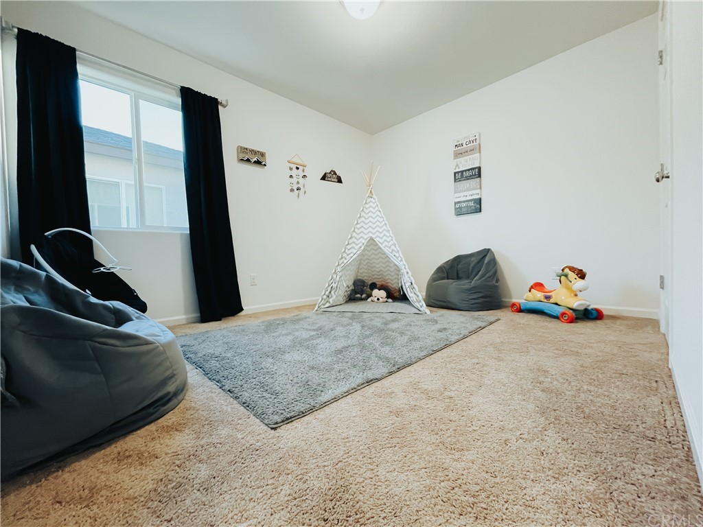 385 Ostrander Avenue Merced, CA 95341 - Photo 9 of 12 a bedroom with a bed and wooden floor