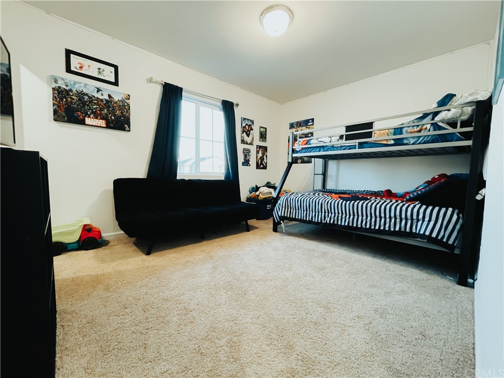 385 Ostrander Avenue Merced, CA 95341 - Photo 10 of 12 a bedroom with furniture and a window