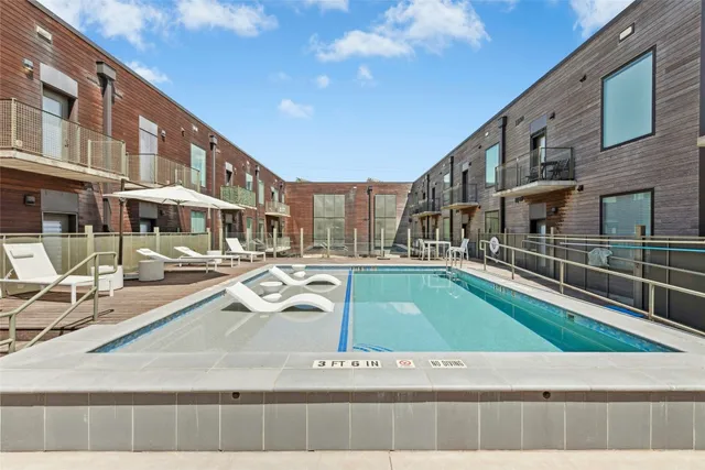 a view of a swimming pool with a lounge chairs