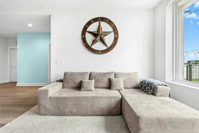 a living room with a couch and a window