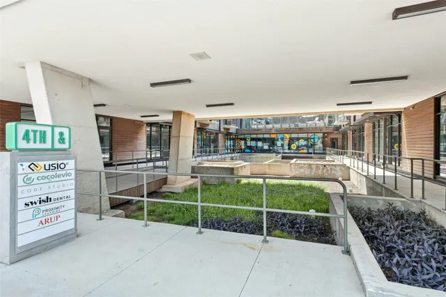 a room with lots of shelves and a wooden floor