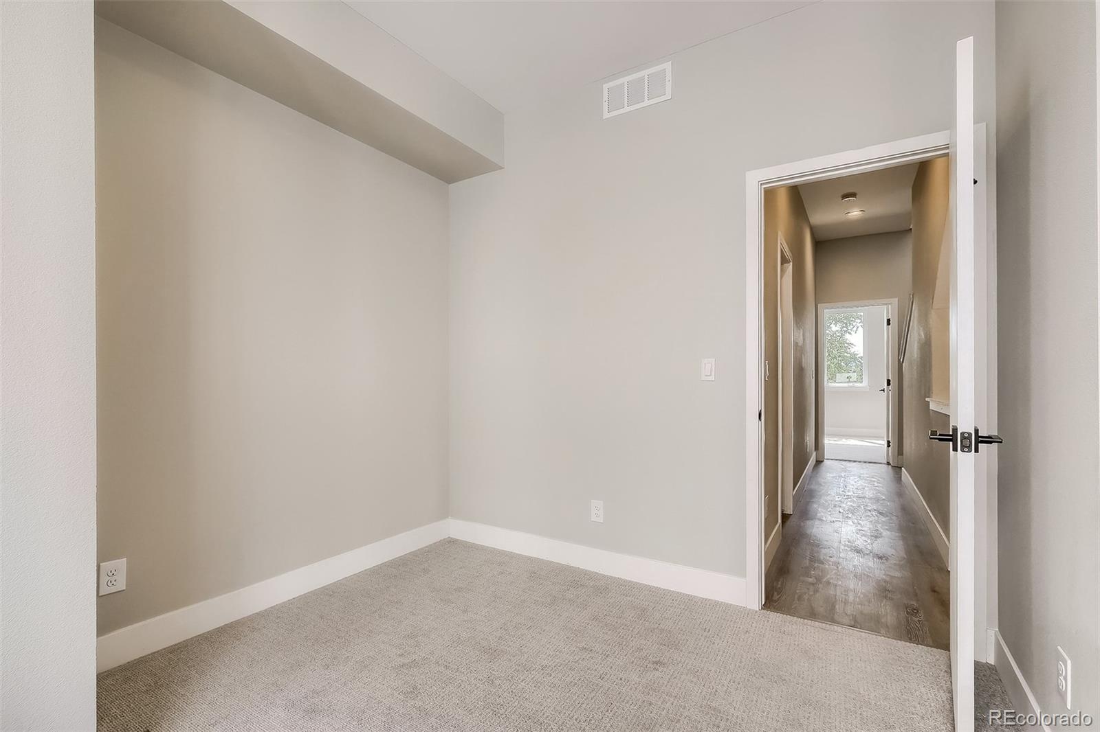 3820 Jason Street, Unit 6 Denver, CO 80211 - Photo 20 of 31 wooden floor in a hall with an entryway