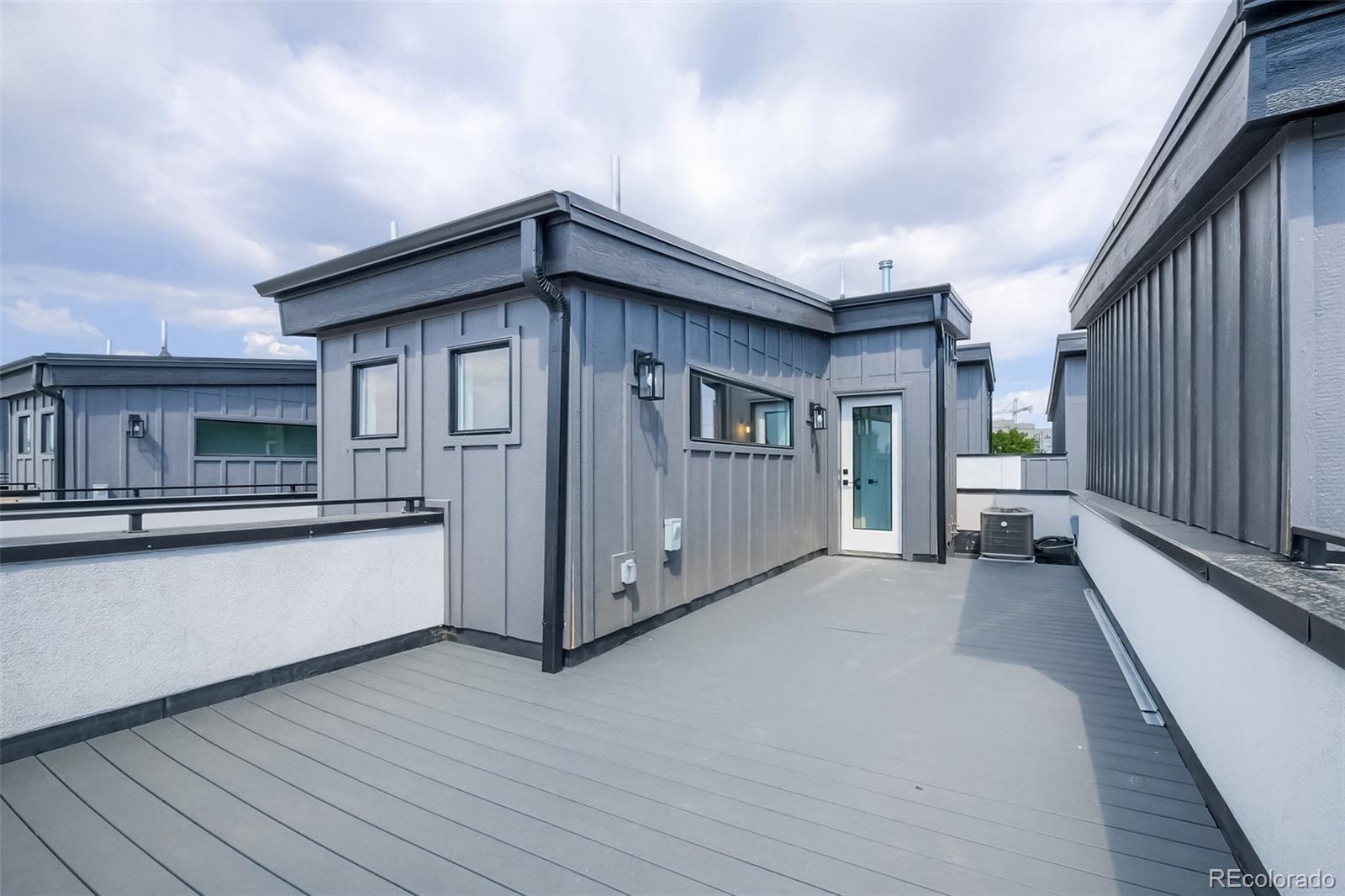 3820 Jason Street, Unit 6 Denver, CO 80211 - Photo 27 of 31 a view of a house with a balcony and wooden fence