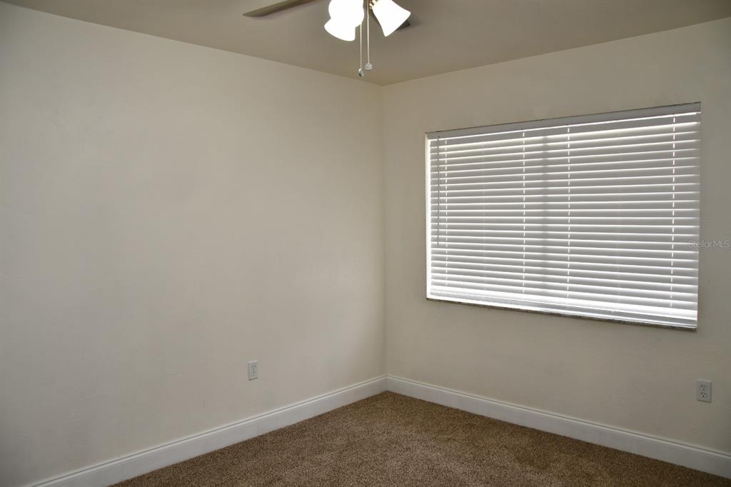 2635 Southwest 35th Place, Unit 1302 Gainesville, FL 32608 - Photo 11 of 17 an empty room with a window