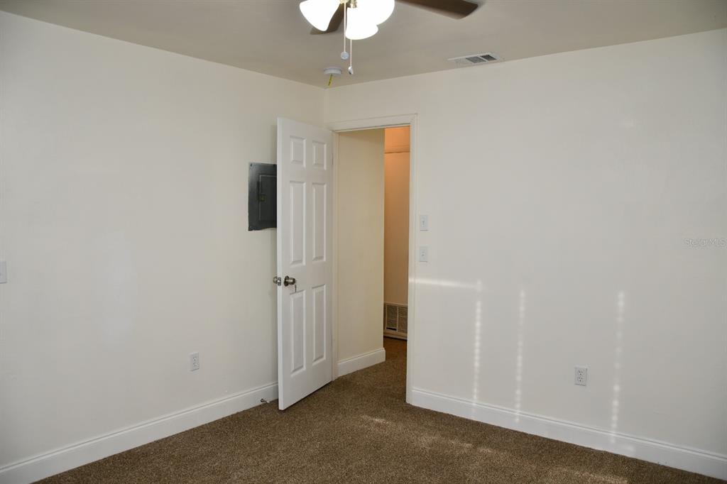 2635 Southwest 35th Place, Unit 1302 Gainesville, FL 32608 - Photo 12 of 17 wooden floor in an empty room