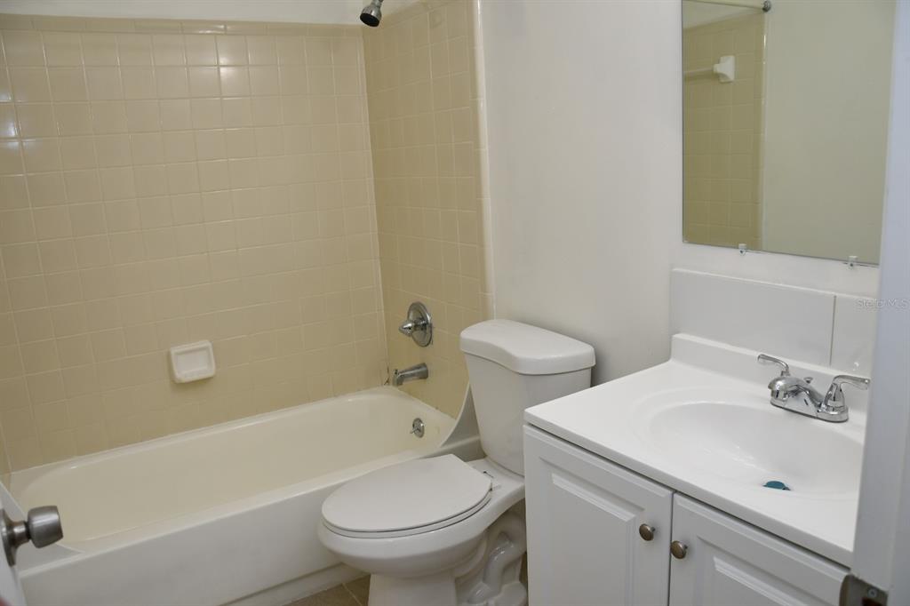 2635 Southwest 35th Place, Unit 1302 Gainesville, FL 32608 - Photo 13 of 17 a bathroom with a sink and a toilet