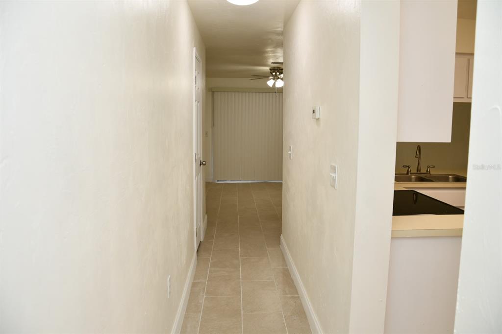 2635 Southwest 35th Place, Unit 1302 Gainesville, FL 32608 - Photo 3 of 17 a view of a bathroom from a hallway