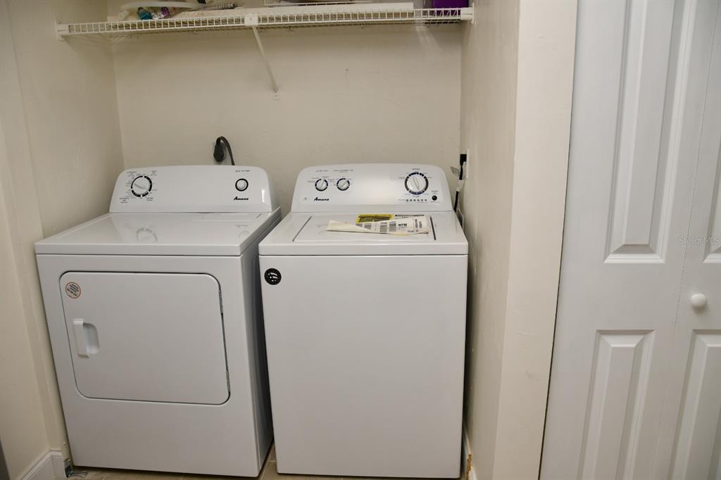 2635 Southwest 35th Place, Unit 1302 Gainesville, FL 32608 - Photo 6 of 17 a utility room with dryer and washer