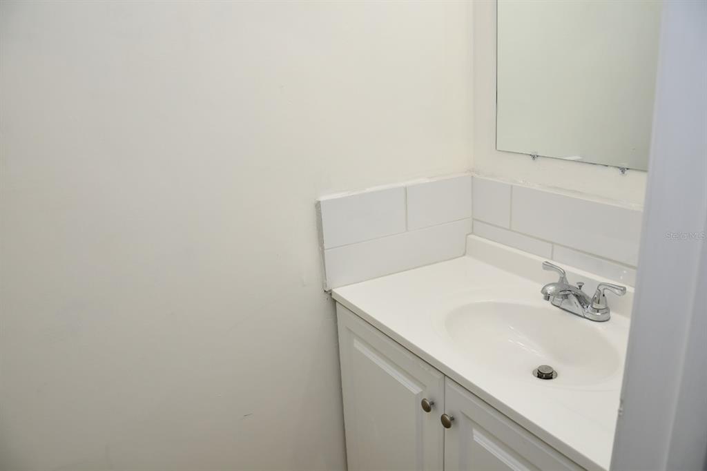 2635 Southwest 35th Place, Unit 1302 Gainesville, FL 32608 - Photo 8 of 17 a bathroom with a sink and vanity