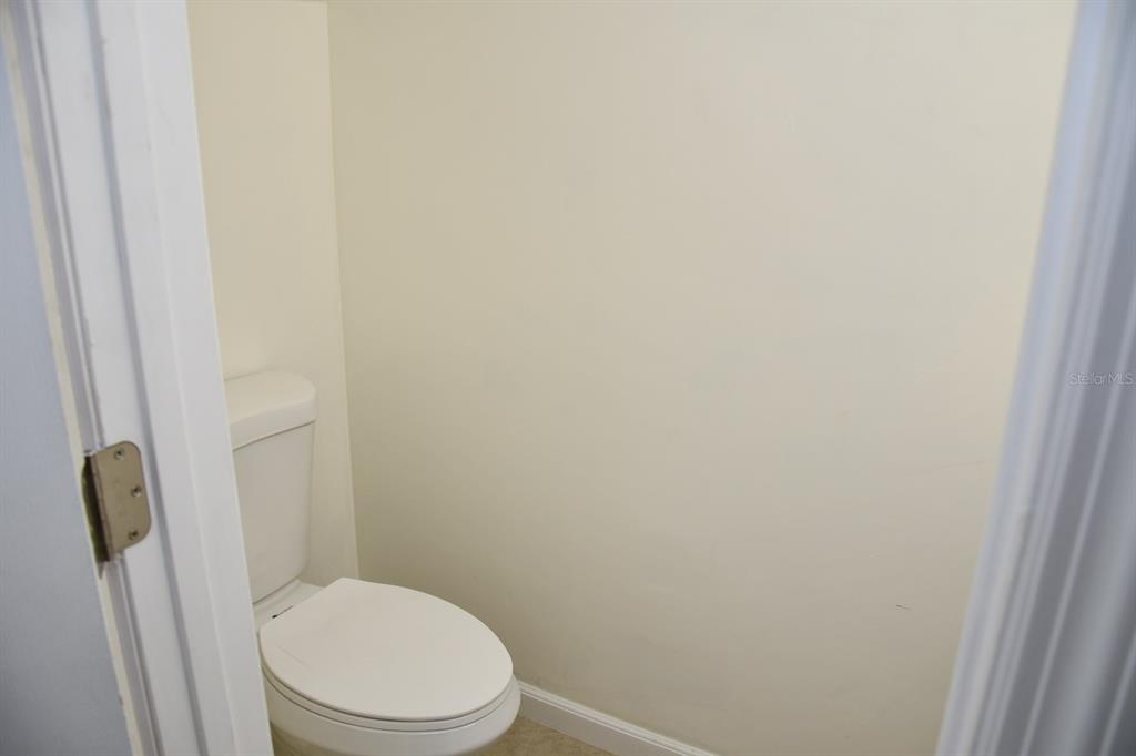 2635 Southwest 35th Place, Unit 1302 Gainesville, FL 32608 - Photo 9 of 17 a white toilet sitting next to a shower