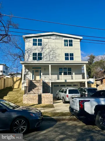 a view of a building with car parked