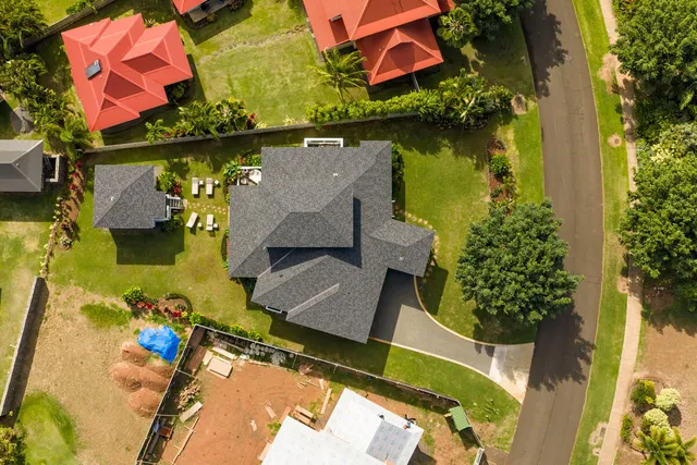 an aerial view of a house with a lake view