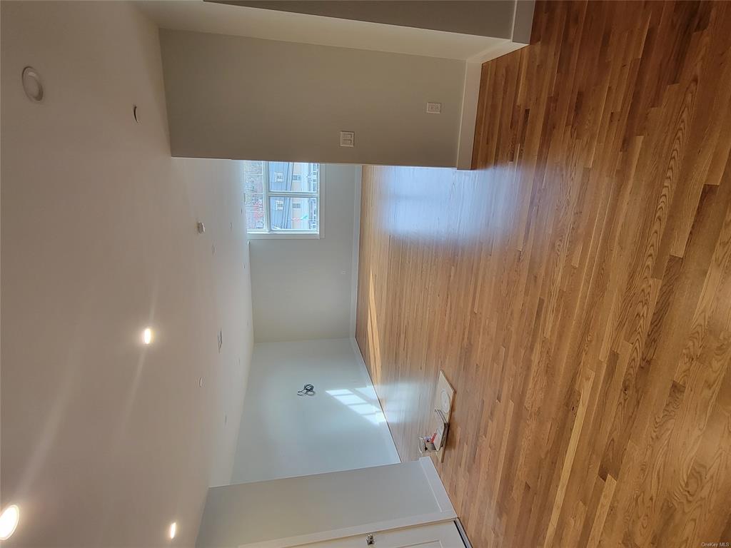 731 Broadway, Unit 4 Valhalla, NY 10595 - Photo 17 of 25 a view of empty room with wooden floor