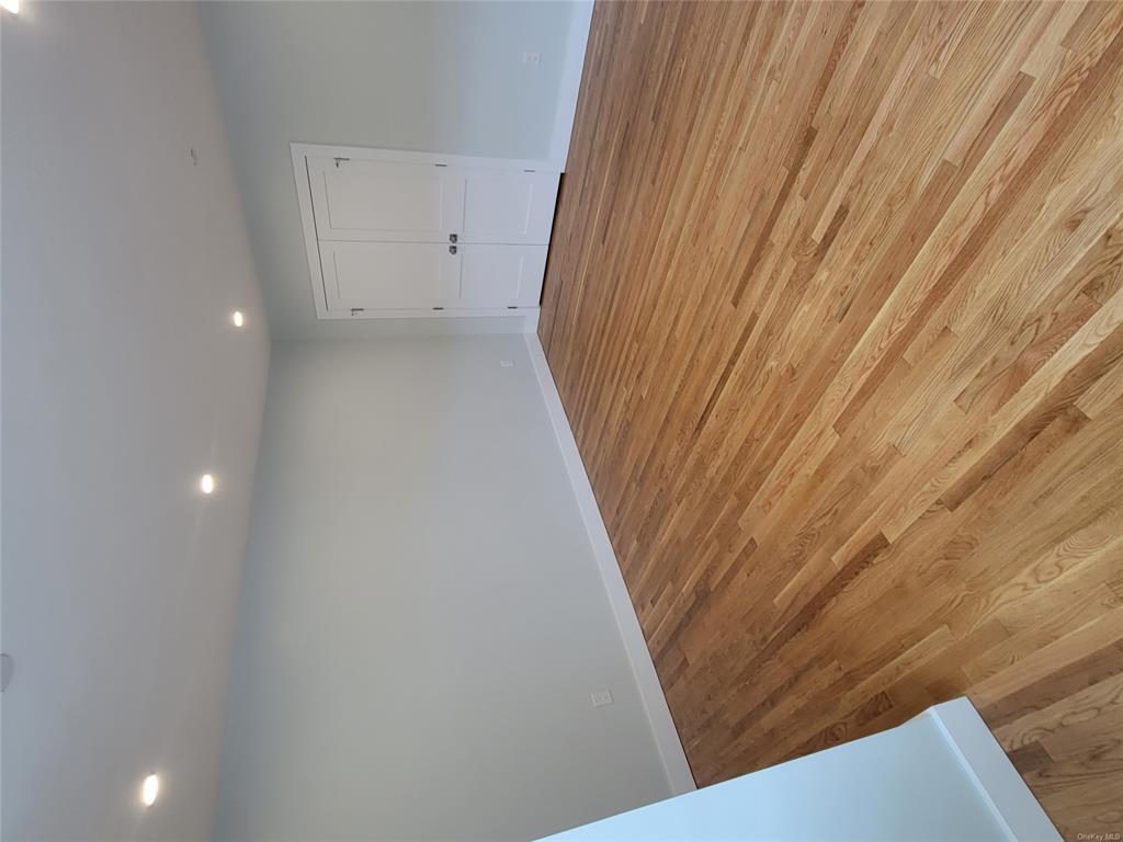731 Broadway, Unit 4 Valhalla, NY 10595 - Photo 20 of 25 a view of empty room with wooden floor