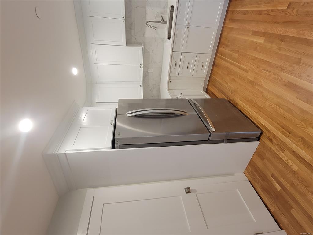 731 Broadway, Unit 4 Valhalla, NY 10595 - Photo 2 of 25 a kitchen with granite countertop a refrigerator and a sink