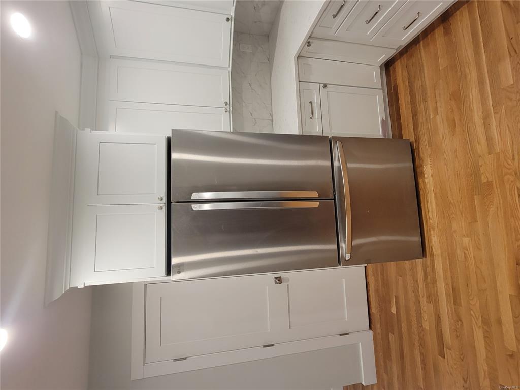 731 Broadway, Unit 4 Valhalla, NY 10595 - Photo 3 of 25 a metallic refrigerator freezer sitting in a kitchen