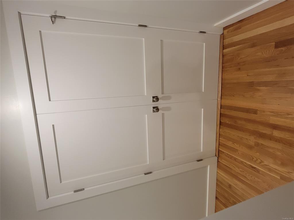 731 Broadway, Unit 4 Valhalla, NY 10595 - Photo 6 of 25 a view of a room with racks on the wall