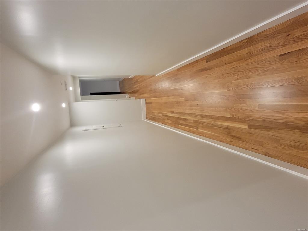 731 Broadway, Unit 4 Valhalla, NY 10595 - Photo 8 of 25 a view of hallway with wooden floor