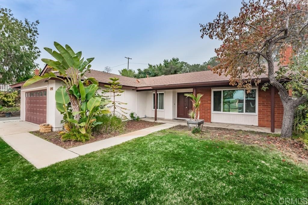 128 Witham Road Encinitas, CA 92024 - Photo 1 of 1 a view of a house with a yard and sitting area