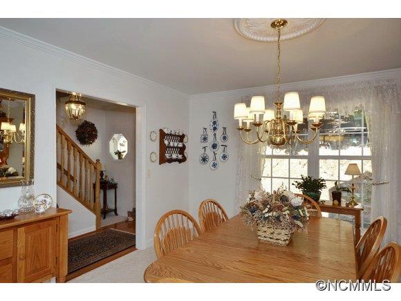 30 Splendor Ridge Waynesville, NC 28785 - Photo 12 of 23 a dining room with furniture a chandelier and window