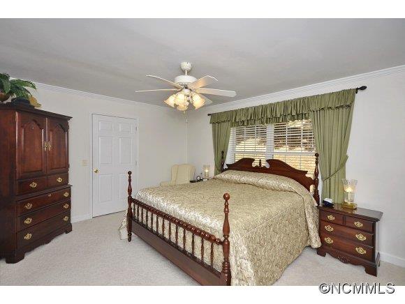 30 Splendor Ridge Waynesville, NC 28785 - Photo 14 of 23 a bedroom with a bed window and a dresser