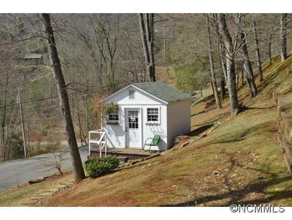 30 Splendor Ridge Waynesville, NC 28785 - Photo 21 of 23 a view of a wooden house with a yard