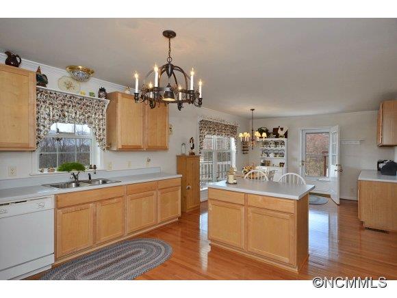 30 Splendor Ridge Waynesville, NC 28785 - Photo 7 of 23 a kitchen with stainless steel appliances kitchen island granite countertop a sink and cabinets