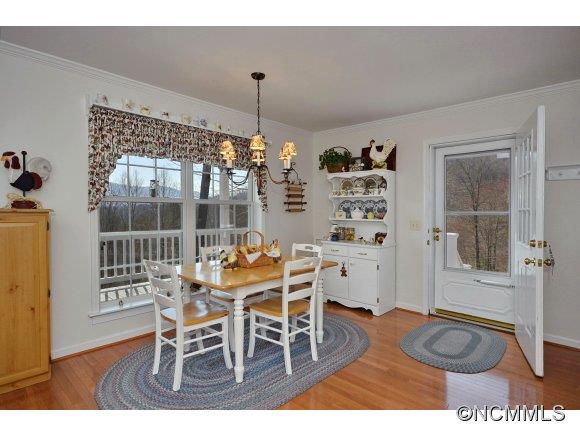 30 Splendor Ridge Waynesville, NC 28785 - Photo 8 of 23 a view of a dining room with furniture and wooden floor