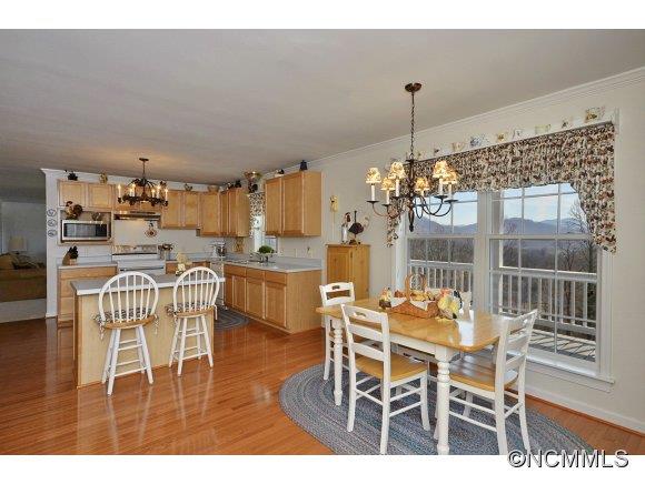 30 Splendor Ridge Waynesville, NC 28785 - Photo 9 of 23 a dining room with furniture a chandelier and window