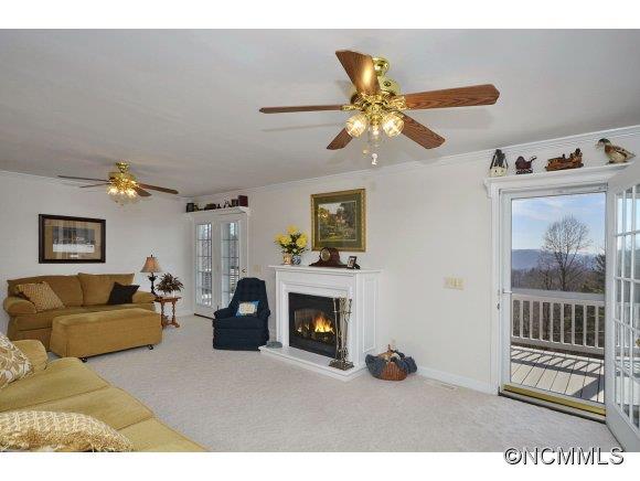 30 Splendor Ridge Waynesville, NC 28785 - Photo 10 of 23 a living room with furniture a fireplace and a window