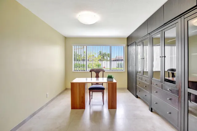 a view of a livingroom with furniture window and wooden floor
