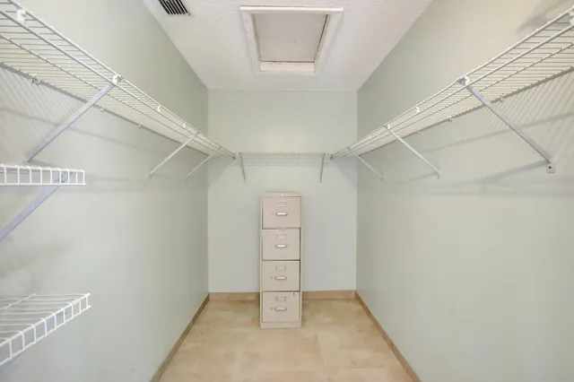 a bedroom with bed and a window