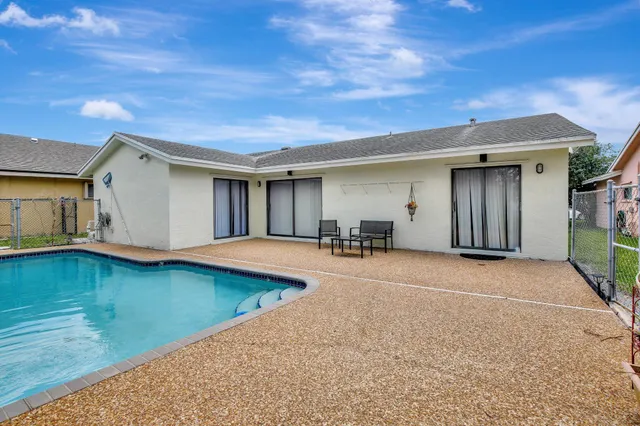 a view of a swimming pool with a patio