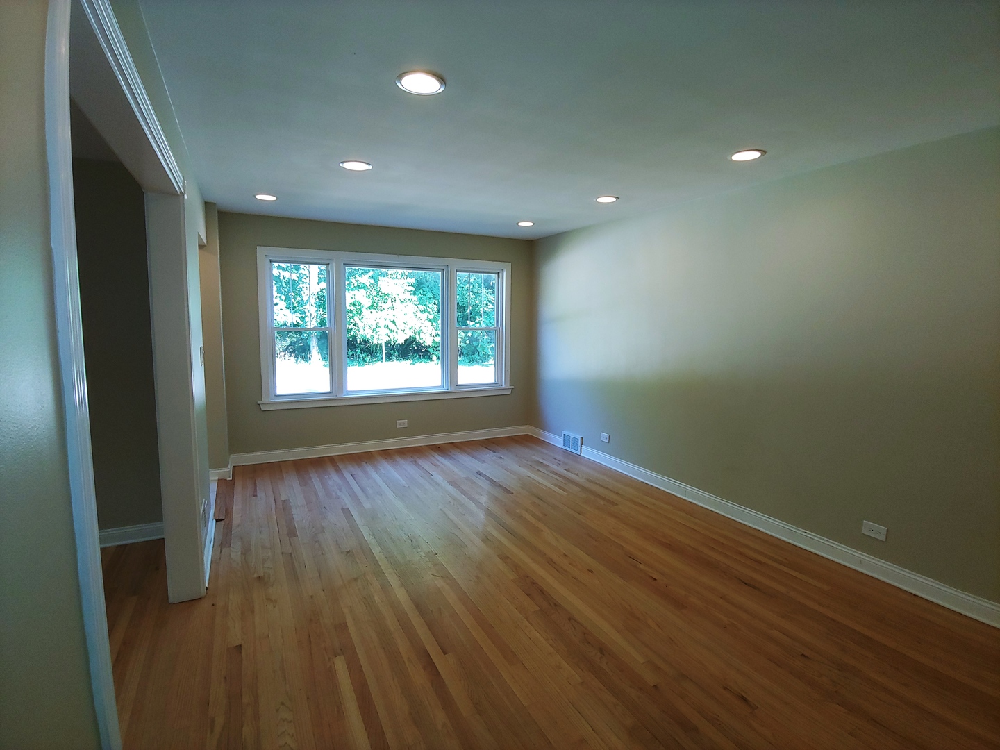 2831 Indian Boundary Road River Grove, IL 60171 - Photo 4 of 19 an empty room with wooden floor and windows