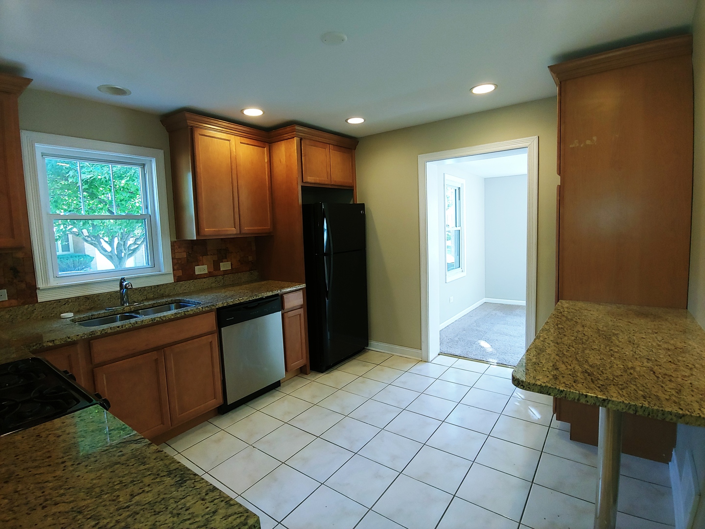 2831 Indian Boundary Road River Grove, IL 60171 - Photo 9 of 19 a kitchen with stainless steel appliances granite countertop a refrigerator and a sink