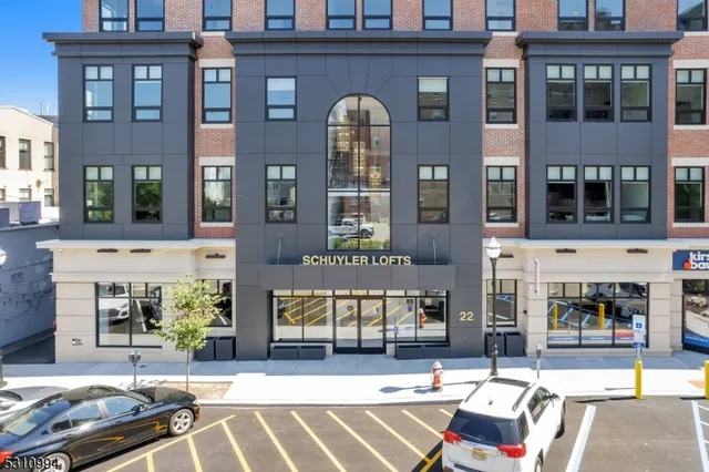 a front view of a building with a outdoor space