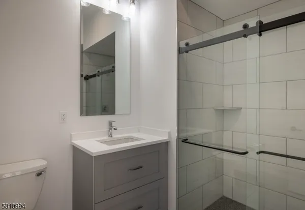 a bathroom with a sink and mirror