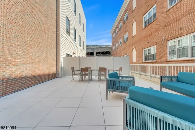 a building outdoor space with patio furniture