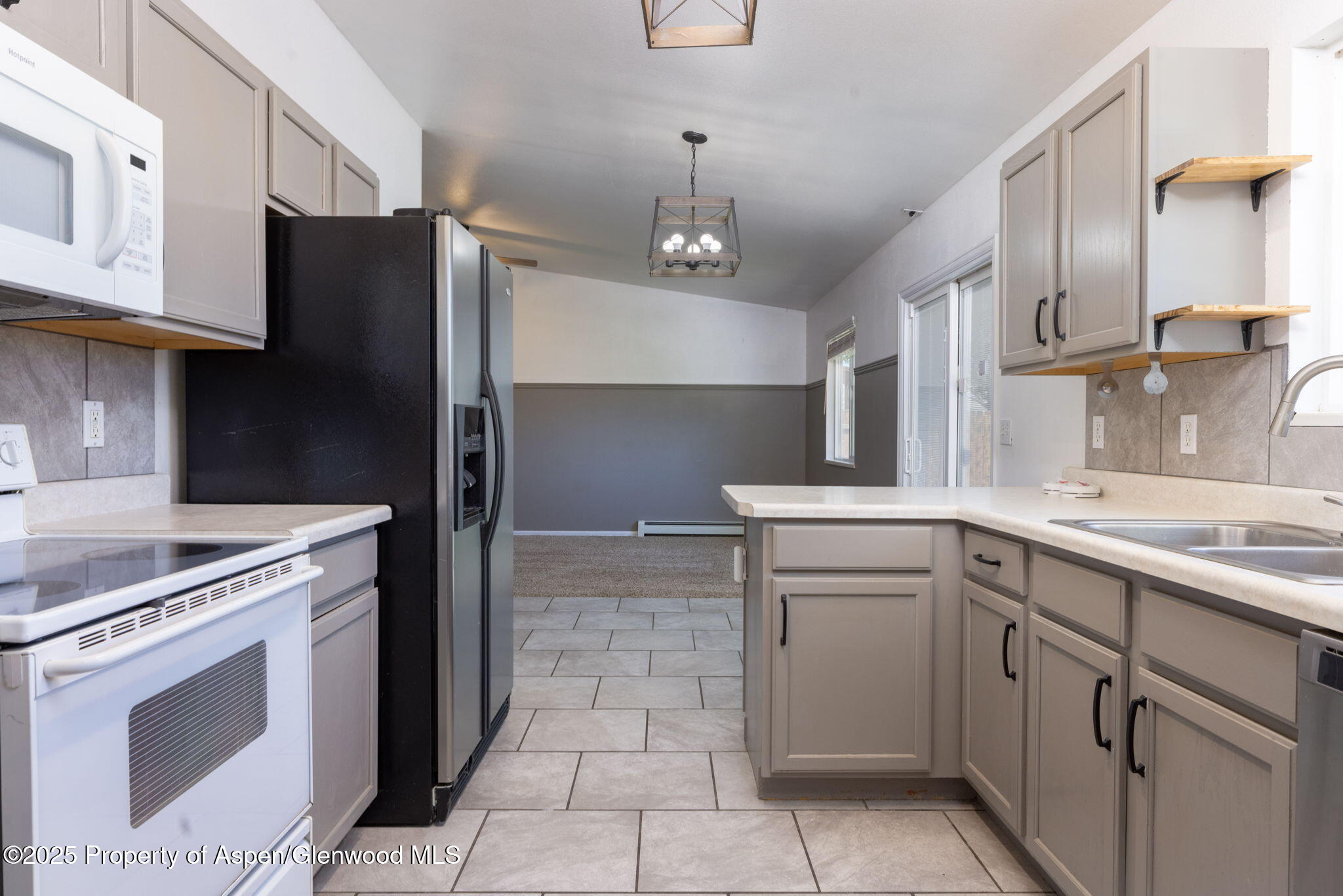 482 Fox Run Clifton, CO 81520 - Photo 18 of 25 a kitchen with a stove sink and refrigerator