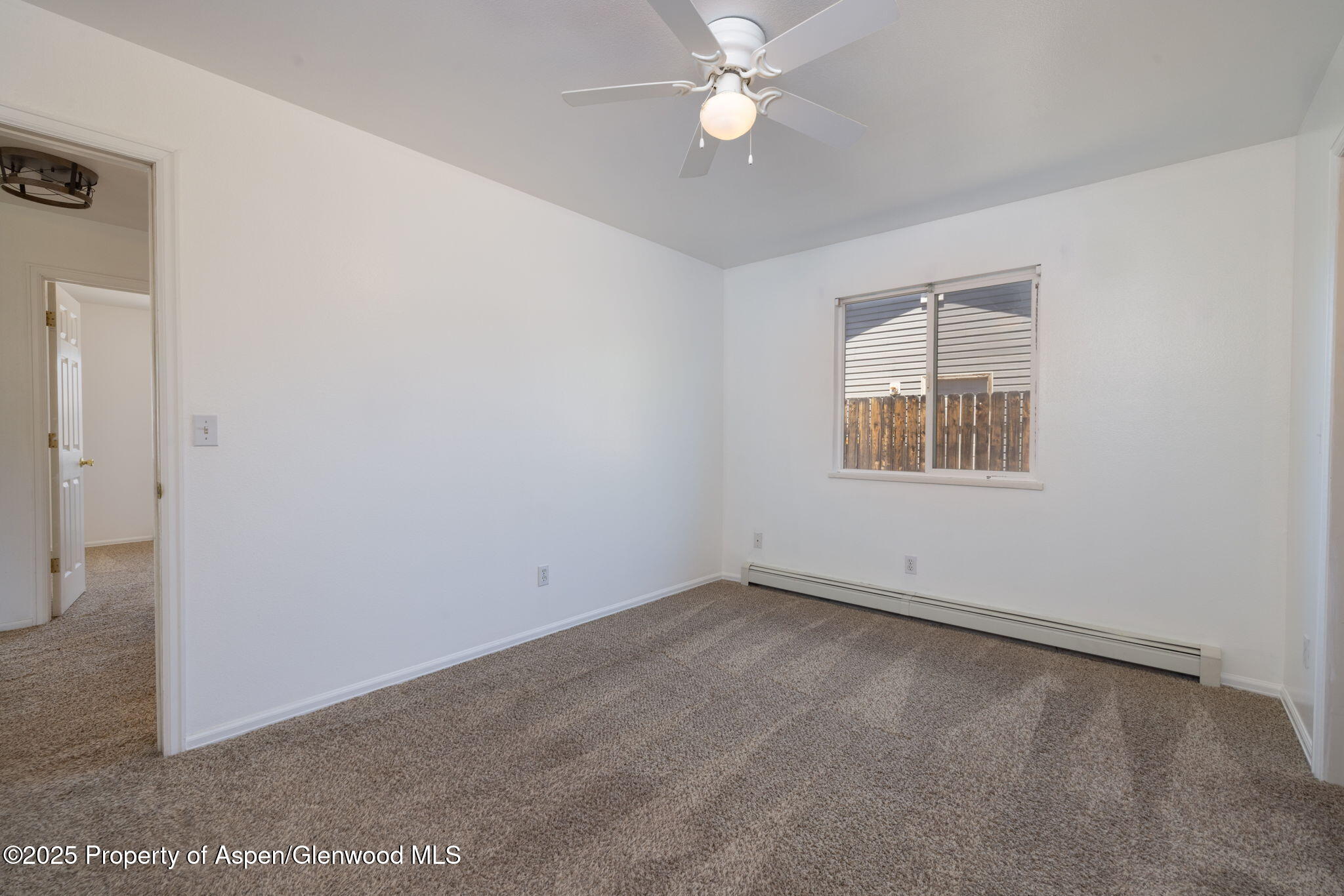 482 Fox Run Clifton, CO 81520 - Photo 7 of 25 an empty room with a window